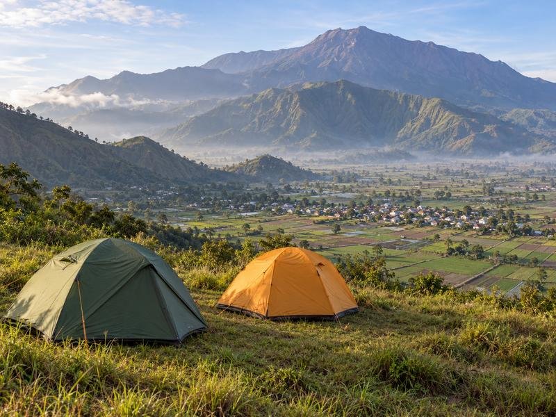 Camping tents overlooking the valley beneath Mount Rinjani