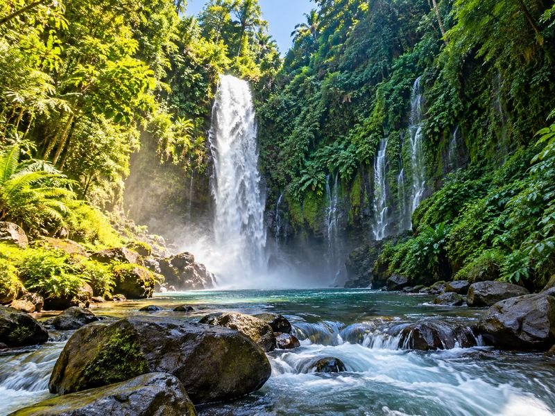 Sendang Gile waterfall surrounded by tropical forest in North Lombok